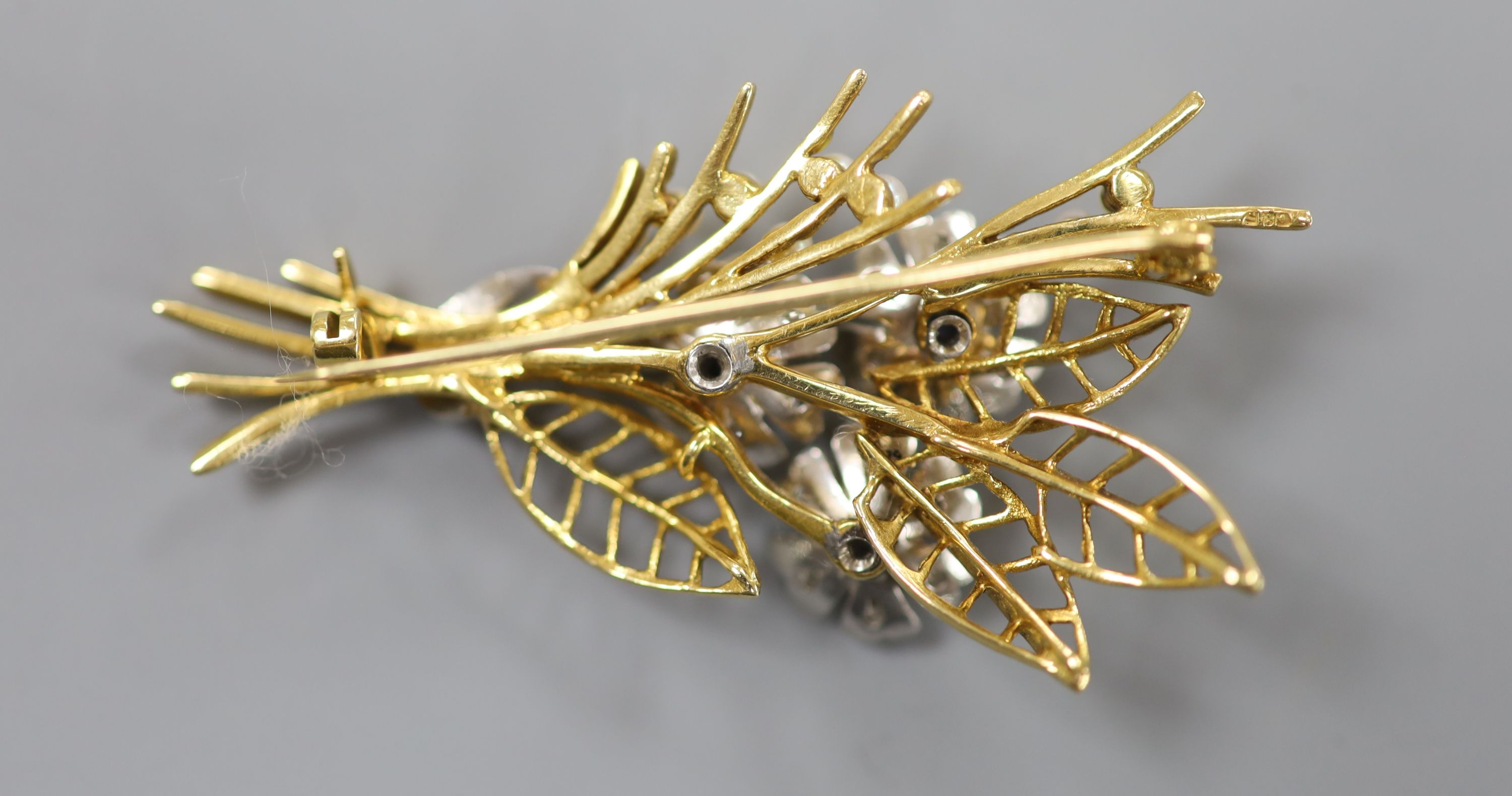 A modern two colour 14ct gold, sapphire, diamond and seed pearl set floral spray brooch, by Cropp & Farr